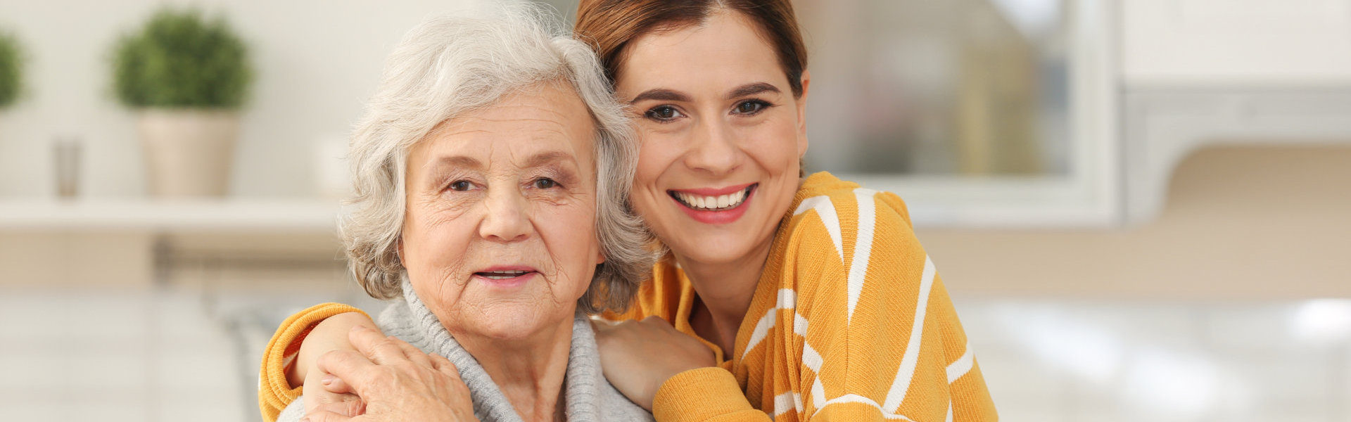 nurse hugging senior